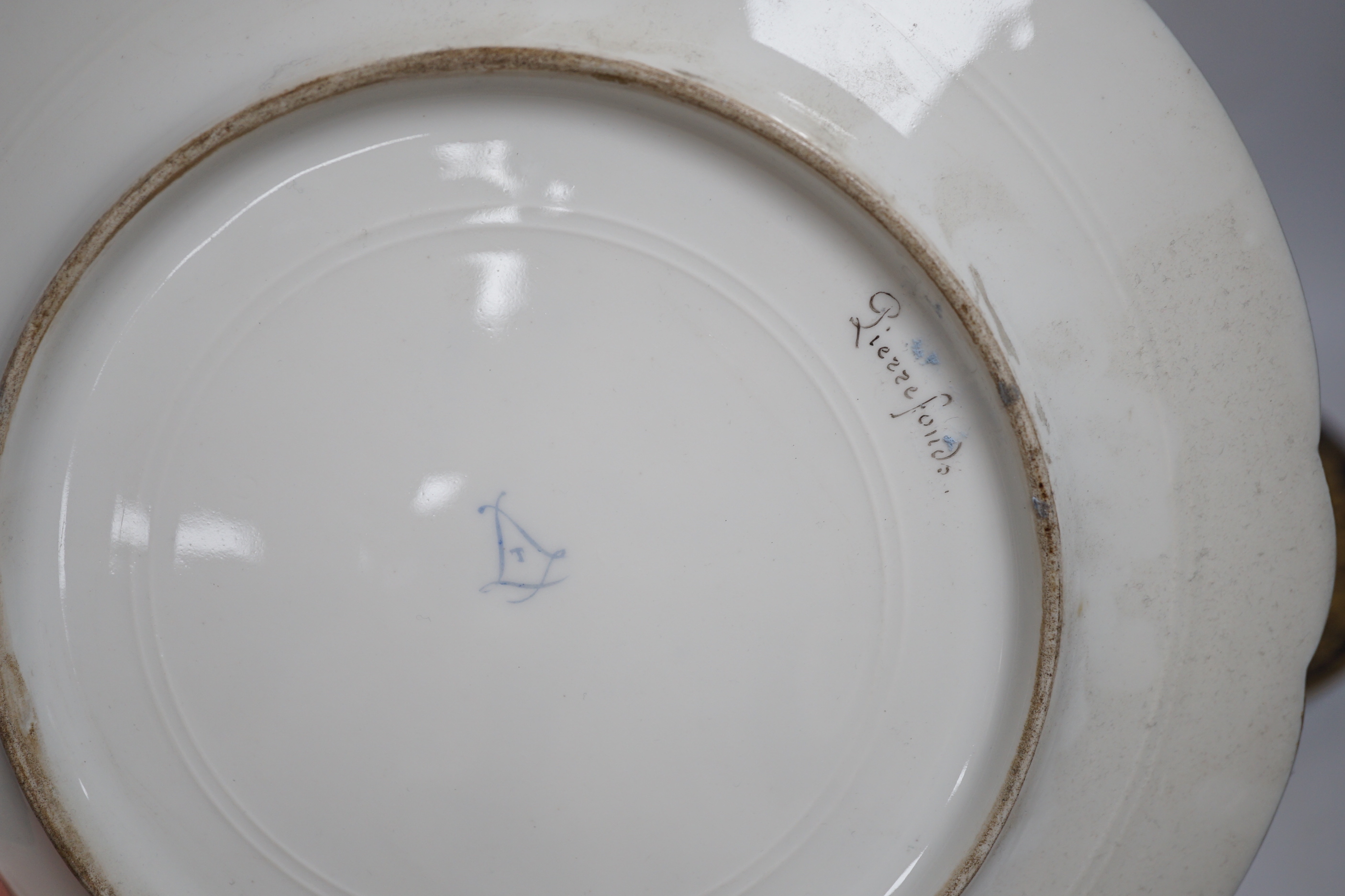 A pair of Sevres style blue cabinet plates, each decorated with a chateau, 24.5cm diameter